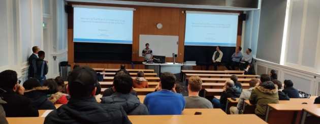 Students in lecture theatre for doctoral research event