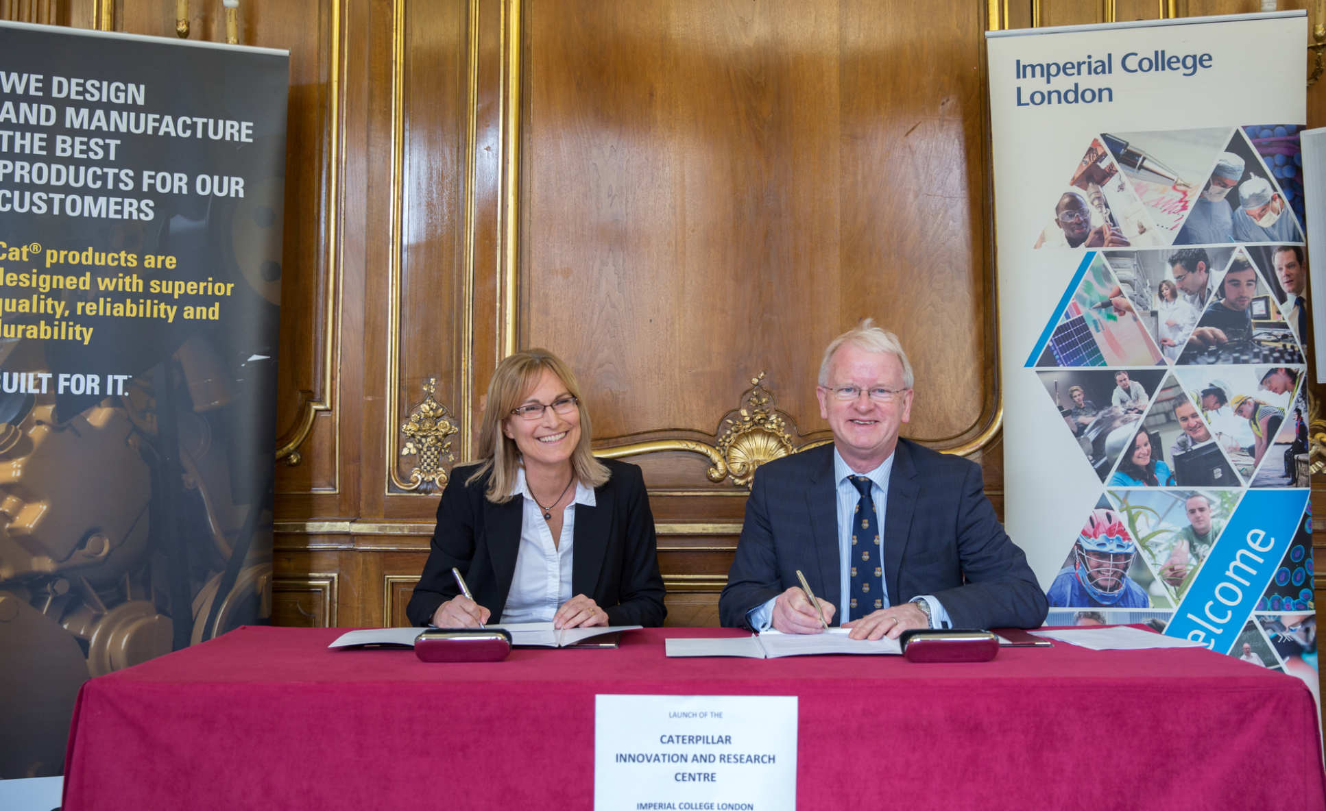 Dr Lou Balmer-Millar with Provost James Stirling, signing the Caterpillar-Imperial I&RC agreement